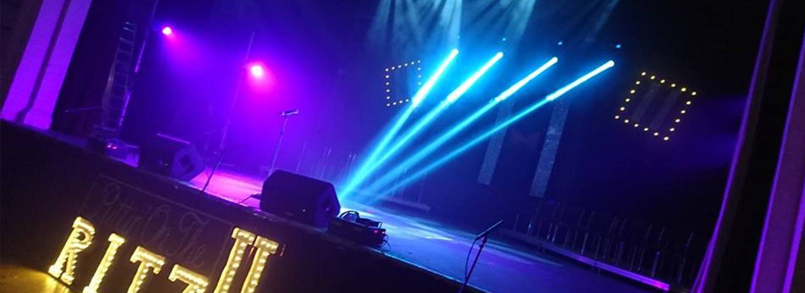 Blue beams across the stage at Puttin' on the Ritz